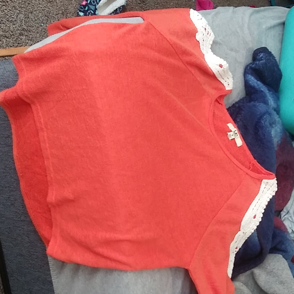 Orange shoulder cut off shirt
